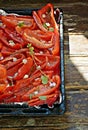 Fresh red bell pepper paprika  sliced Ã¢â¬â¹Ã¢â¬â¹and ready to roast dried with olive oil, garlic, Provence herbs Royalty Free Stock Photo